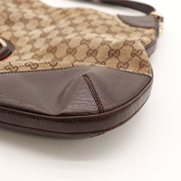 Détail coin bas droit frottements cuir marron Hobo Gucci Horsebit — AMANA Vintage
