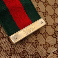 Détail plaque dorée Gucci bande Web verte rouge vintage — AMANA Vintage