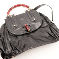 Détail fermoir piston bambou rouge Tote Bag Gucci — AMANA Vintage