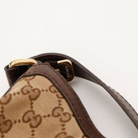 Détail anse cuir marron sac Gucci Hobo Web occasion authentique — AMANA Vintage
