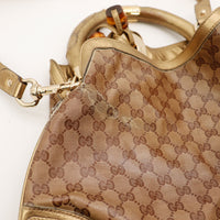 Detail toile GG Crystal et anse Gucci Indy Hobo occasion — AMANA Vintage
