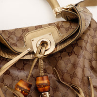 Detail embouts bambou et franges cuir dore Gucci Indy Hobo occasion — AMANA Vintage