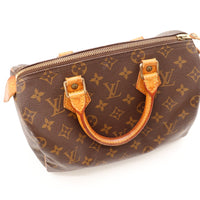 Détail anses et attaches vachette Louis Vuitton Speedy 25 patine caramel — AMANA Vintage