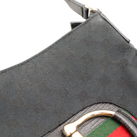 Détail boucle argenterie Gucci marquage doré Hasler noir occasion — AMANA Vintage