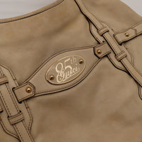 Détail plaque 85th Gucci Hobo Horsebit cuir beige occasion authentique — AMANA Vintage