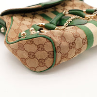Détail coin et clou doré Gucci Hobo Horsebit occasion authentique — AMANA Vintage