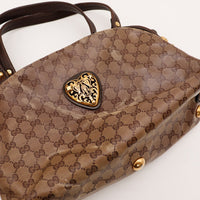 Détail médaillon cœur doré Gucci Babouska occasion authentique — AMANA Vintage