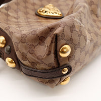 Détail coin et clous dorés Gucci Babouska occasion authentique — AMANA Vintage