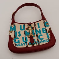Gucci Jackie 1961 Music Is Mine vue du dessus fermoir piston doré toile imprimée occasion — AMANA Vintage
