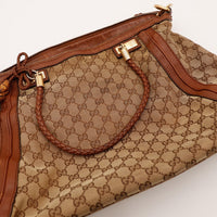 Détail anses tressées et fermeture Gucci Hobo occasion authentique — AMANA Vintage