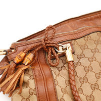 Détail breloque bambou et cuir tressé Gucci Hobo occasion authentique — AMANA Vintage