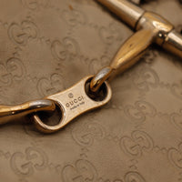 Détail plaque Gucci made in Italy Hobo Horsebit — AMANA Vintage